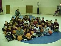 Kids playing basketball in the gym