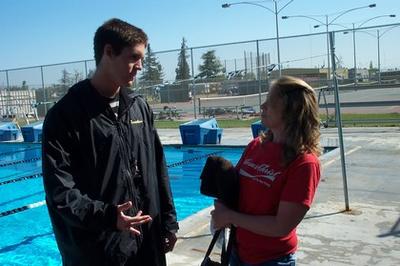 Coach and parent at the pool deck