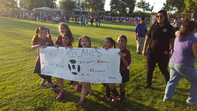 Kids marching in at the Youth Soccer opening ceremonies