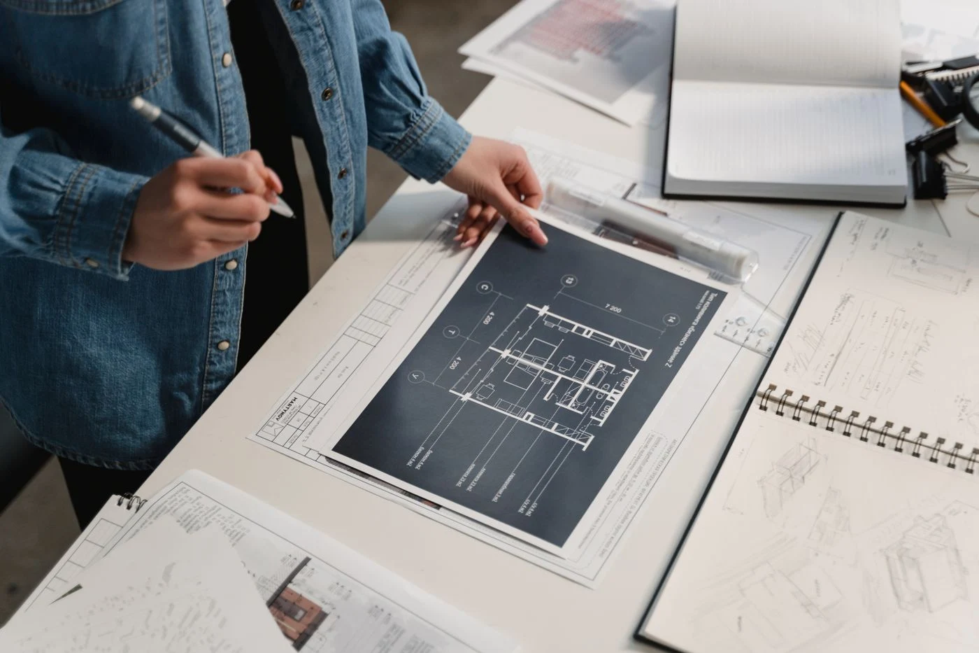 Technical plans being reviewed for project requirements.