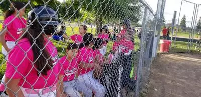 Girls softball team lined up on the field