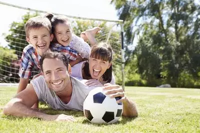 Family together with a soccer ball